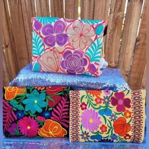 Embroidered envelope cross body pures.